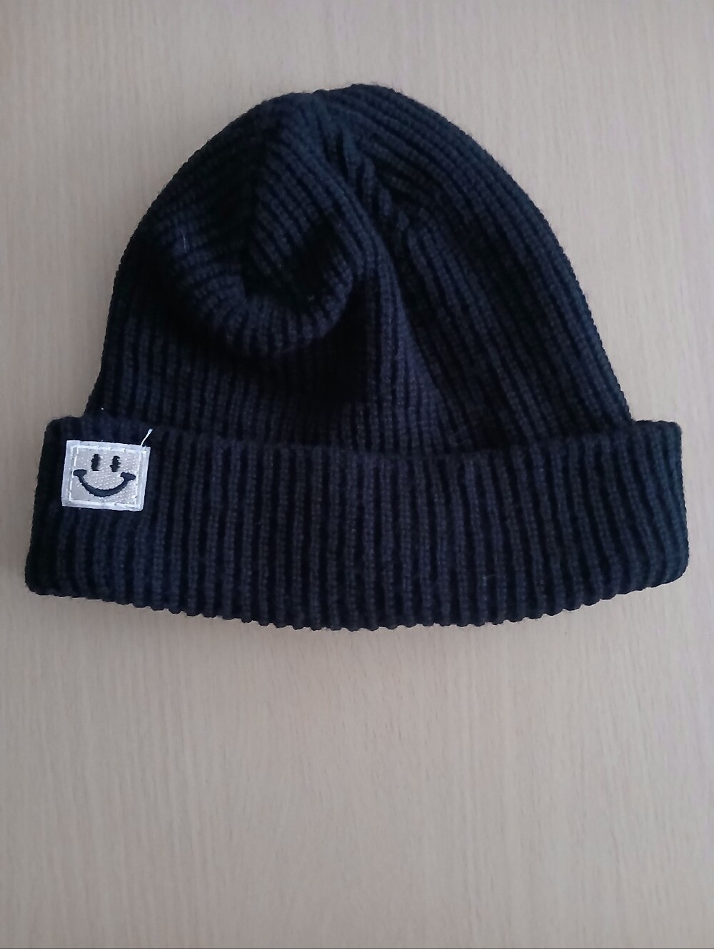 Unisex Black Beanie with Smiley Patch. Like New.